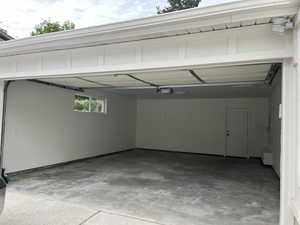 Garage featuring a garage door opener