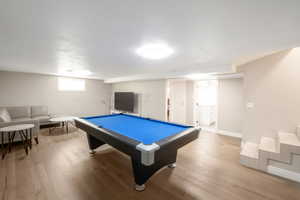 Darts upstairs, billiards down stairs. Each floor comes with an 85 inch flat screen.