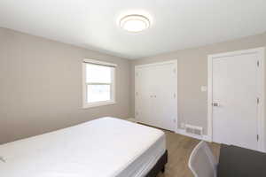 Bedroom #1 with view of closets.