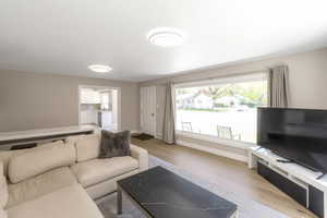 Living room features hardwood floors and huge picture window with great view of the mountains