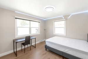 Bedroom #2. Windows bring in plenty of natural light. Blackout shades will keep all of that sunlight out. Queen bed and all bedroom furniture included.