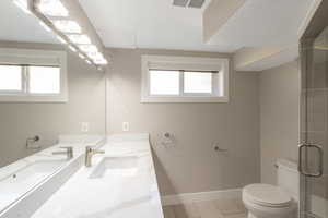 3/4 bath features large vanity, quartz countertops and shower. Look at virtual tour for a better view of bathroom and shower.