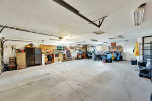 Oversized garage with work area.