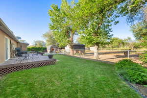 View of East facing backyard, deck and pasture.