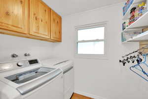 Laundry area with washer and dryer, cabinet space