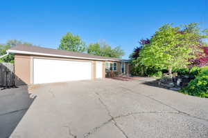 Single story home with attached oversized garage.
