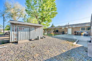 Back of home and storage shed