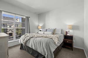 Bedroom with carpet floors and baseboards
