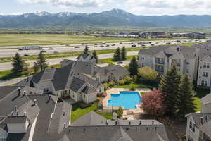 Aerial view of a mountain backdrop and a pool
