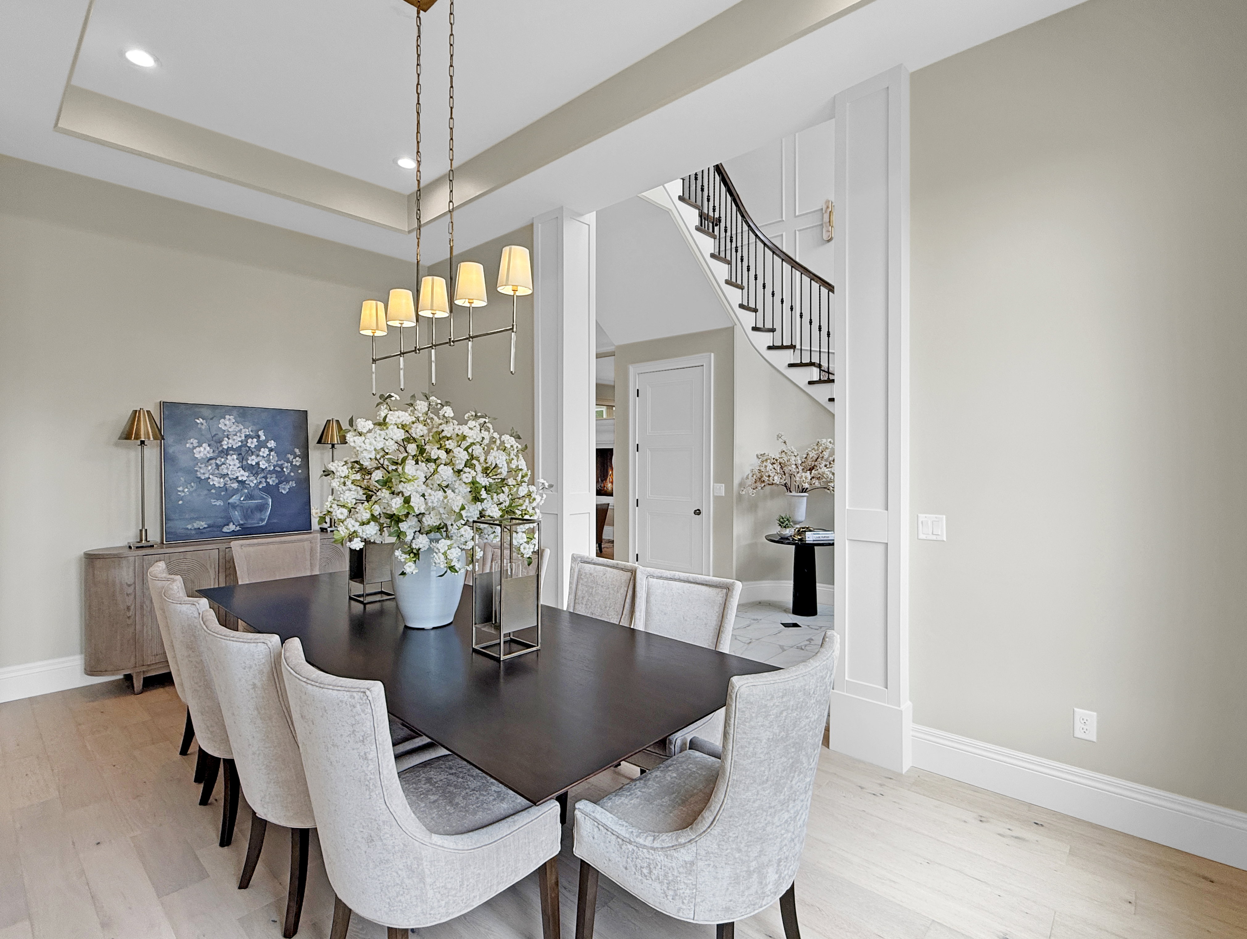 Dining room featuring light wood-type flooring, baseboards, stairs, recessed lighting, and a chandelier
