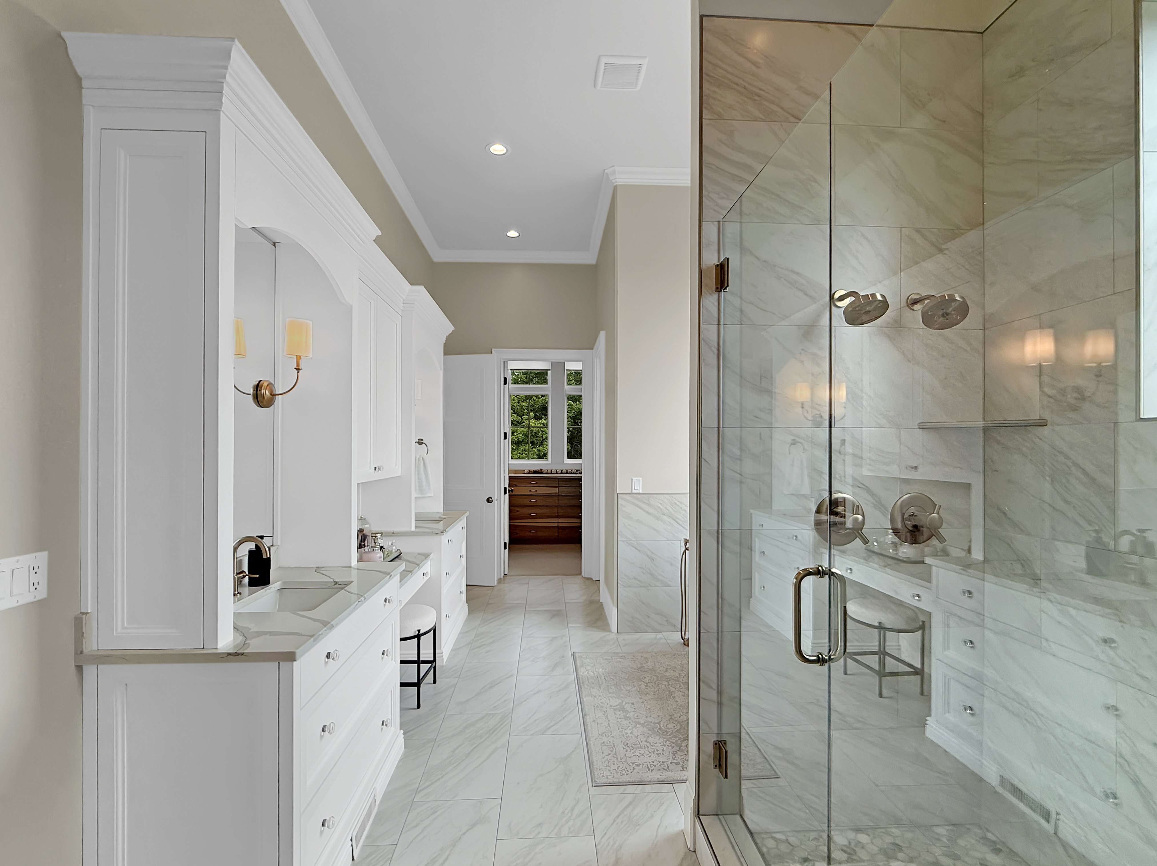 Bathroom featuring vanity, ornamental molding, a stall shower, marble finish floors, and recessed lighting
