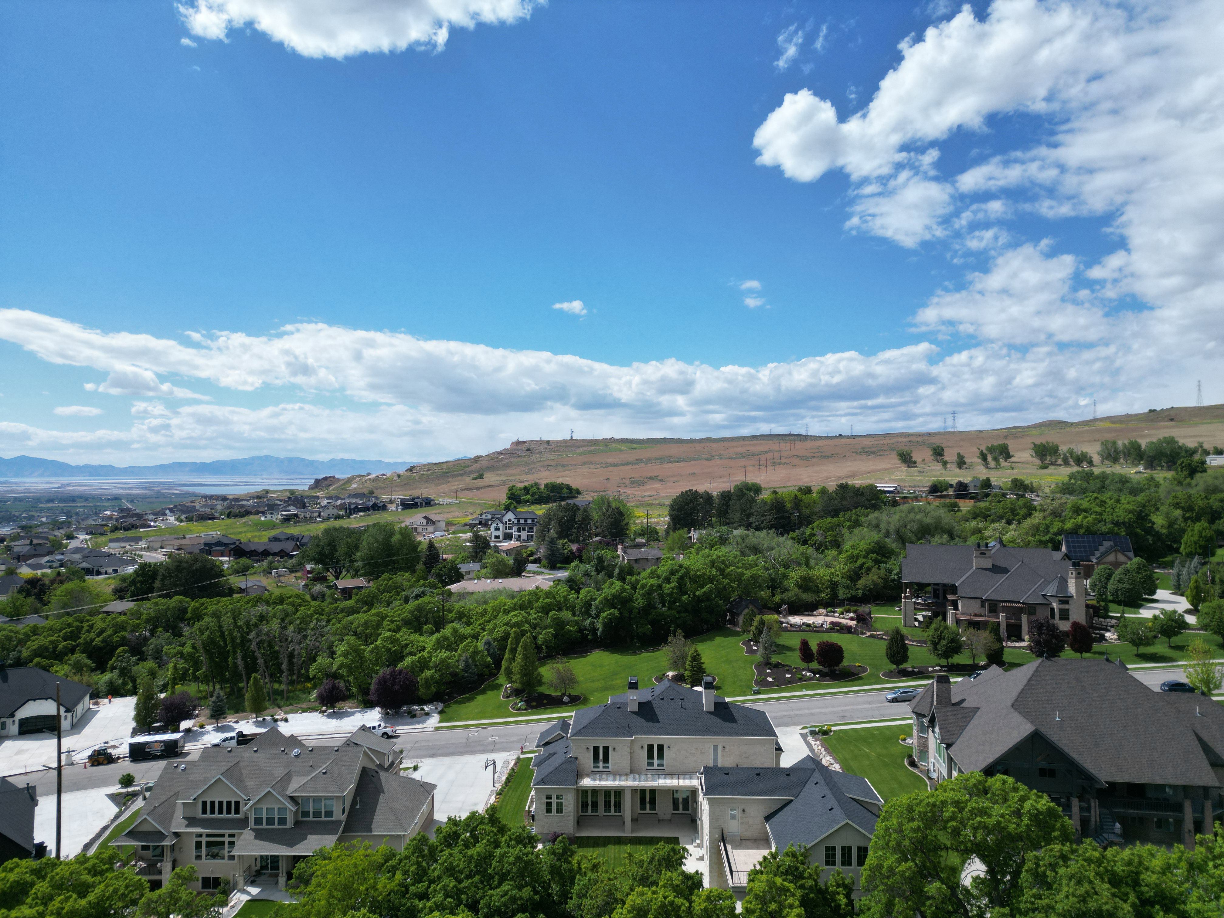 Aerial view of residential area featuring a mountain backdrop