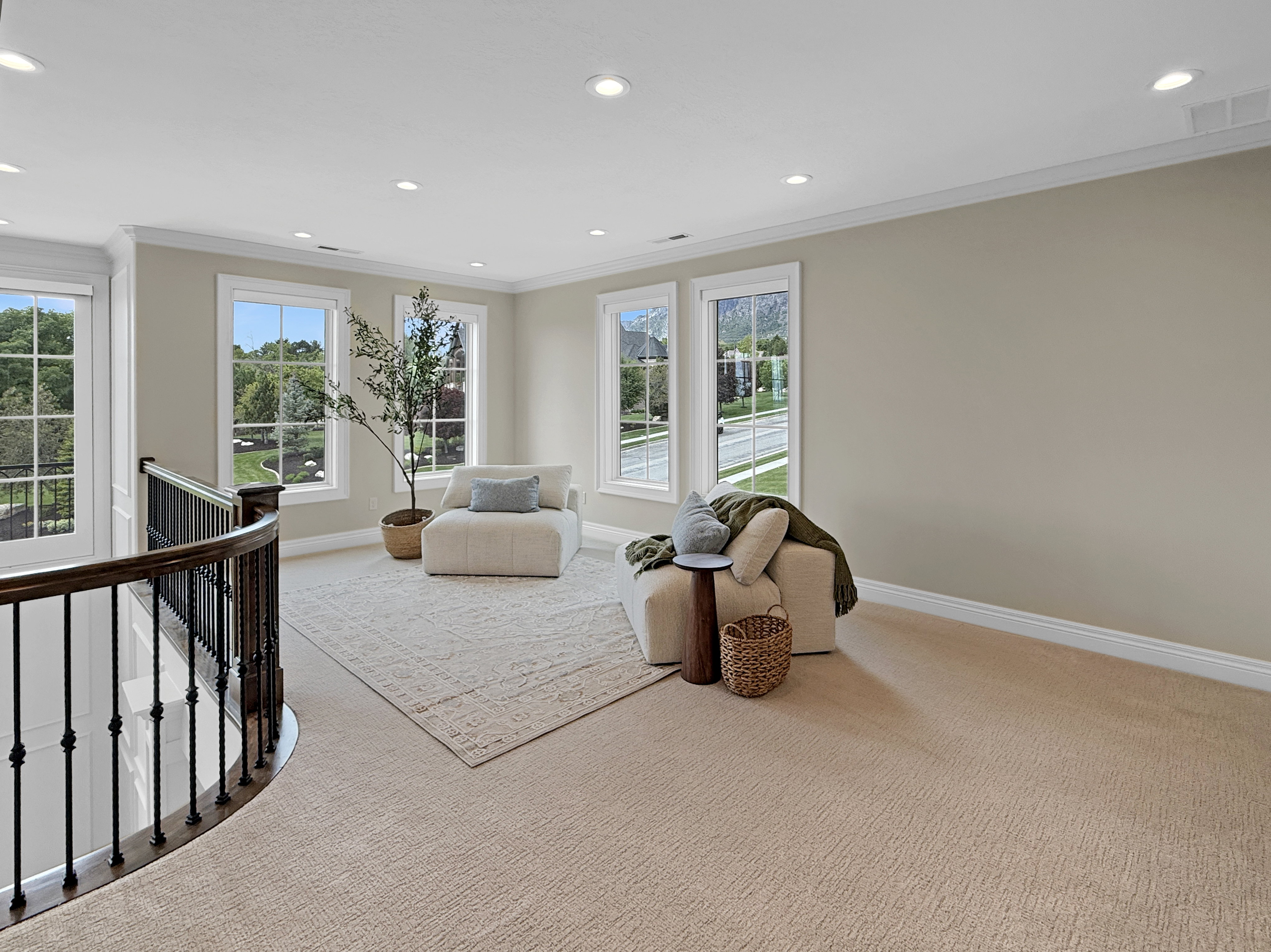 Sitting room with an upstairs landing, carpet floors, ornamental molding, baseboards, and recessed lighting