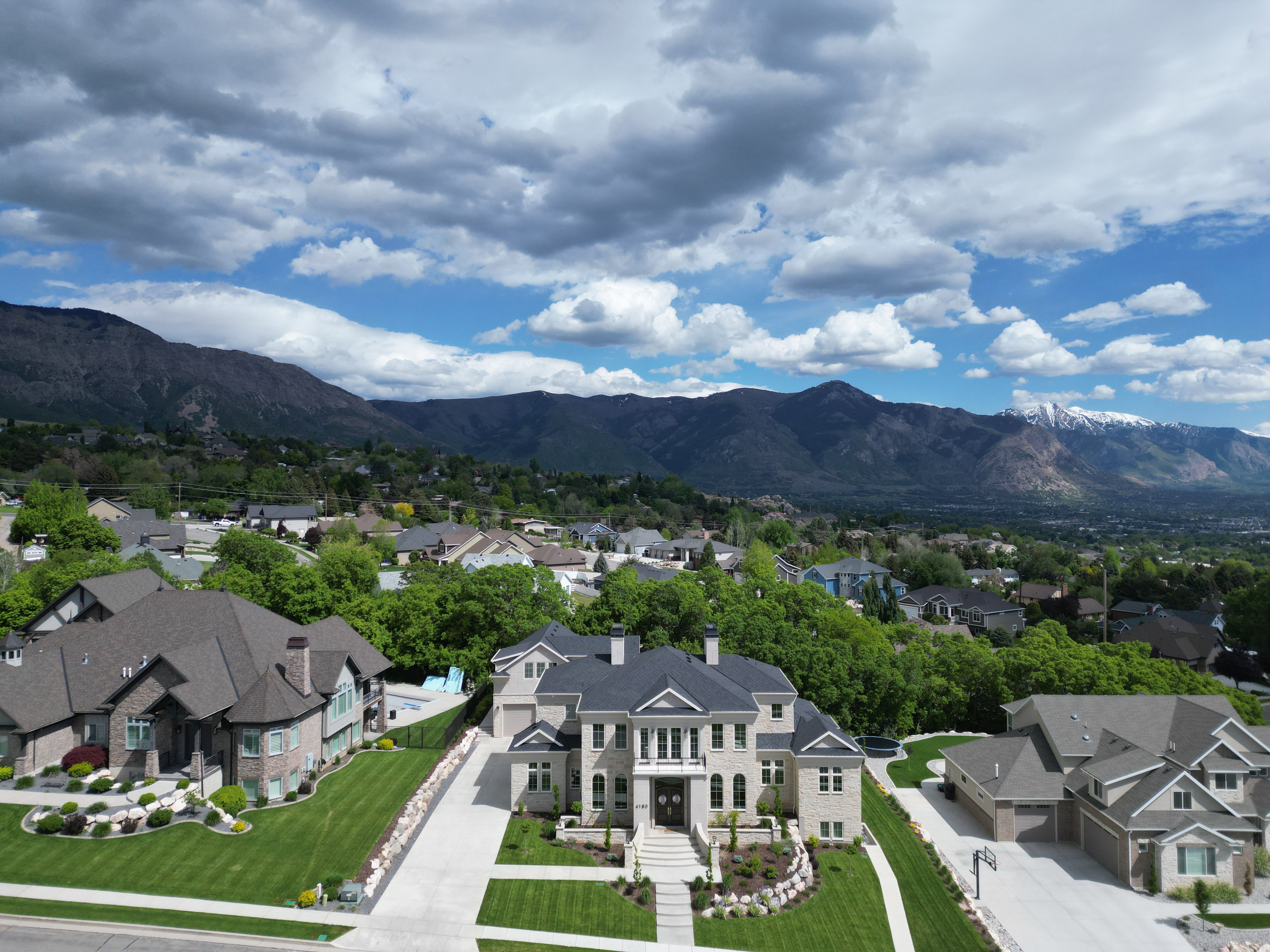 View of mountain background featuring nearby suburban area