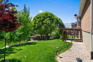 View of yard featuring stairway