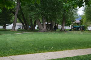 View of yard with a playground