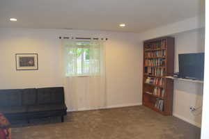 Sitting room featuring carpet, recessed lighting, and baseboards