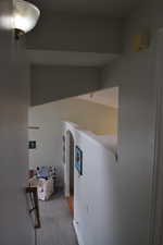 Corridor with carpet floors and arched walkways