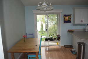 Dining room featuring a chandelier and wood finished floors