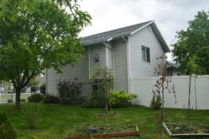 View of property exterior with a vegetable garden