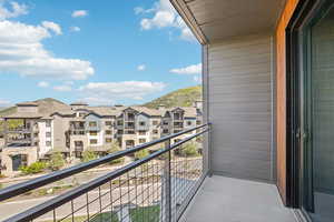 Balcony with a residential view and a mountain view
