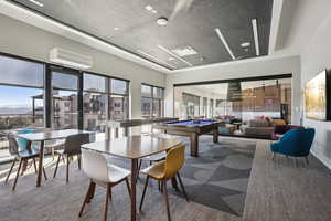 Game room featuring billiards table, healthy amount of natural light, carpet floors, and a mountain view