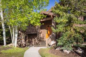 Obstructed view of property featuring board and batten siding