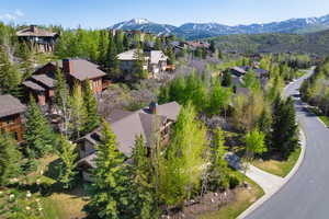 Aerial perspective of suburban area with a mountainous background