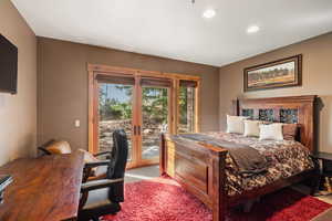 Bedroom featuring access to outside, carpet floors, and recessed lighting