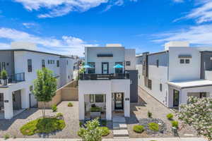 Contemporary home with stucco siding and a residential view