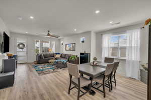 Dining room featuring light wood-style flooring, recessed lighting, a ceiling fan, and baseboards