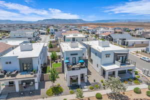 Aerial view of residential area featuring a mountainous background