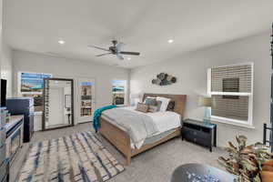 Carpeted bedroom featuring recessed lighting, access to exterior, and ceiling fan