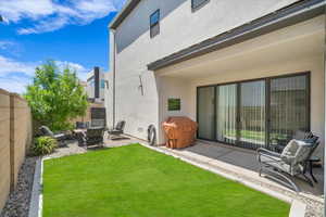 View of yard with a patio and a fire pit