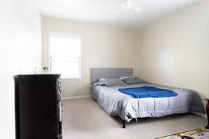 Bedroom featuring carpet flooring and ceiling fan