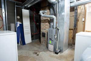 Utility room with washer / dryer and heating unit