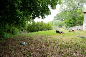 View of yard featuring a playground