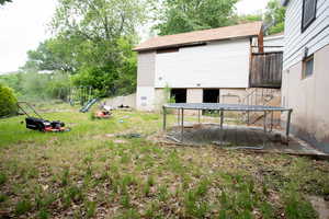 View of yard featuring a playground and a patio area