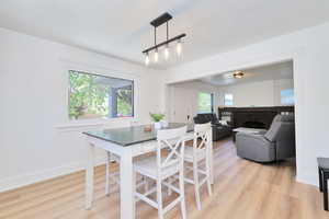 Dining space featuring new LVP flooring and baseboards