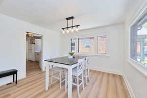 Dining area featuring a new modern light
