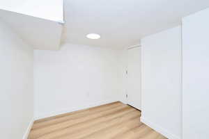 Unfurnished room featuring light wood-style flooring and baseboards