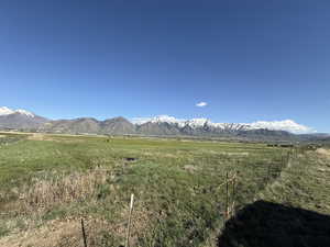View of mountain backdrop with rural landscape