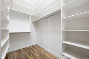Walk in closet featuring wood finished floors