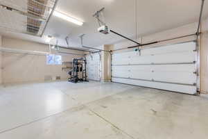 Garage featuring a garage door opener
