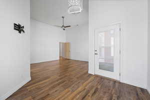 Unfurnished room featuring wood finished floors, baseboards, and ceiling fan
