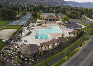 Aerial view of a pool area and a mountain backdrop
