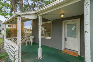 Property entrance featuring stucco siding