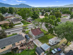 Aerial view of residential area featuring a mountainous background
