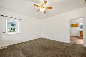 Carpeted living room with natural light