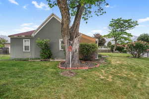 View of side of home with stucco siding
